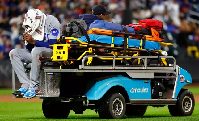 Chicago Cubs' pitcher Edward Cabrera leave the game after an injury during the fifth inning of a baseball game against the New York Mets , Tuesday, June 23, 2026, in New York. (AP Photo/Noah K. Murray)