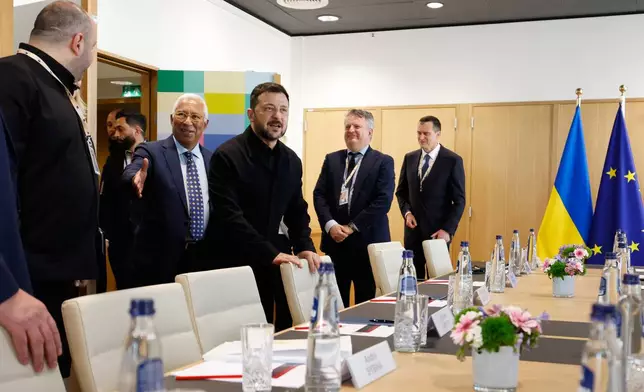 European Council President Antonio Costa, center, prepares to greet Ukraine's Chief of National Security Rustem Umerov, second left, and Ukraine's President Volodymyr Zelenskyy, center, during a meeting on the sidelines of the EU summit in Brussels, Thursday, June 18, 2026. (AP Photo/Geert Vanden Wijngaert, Pool)