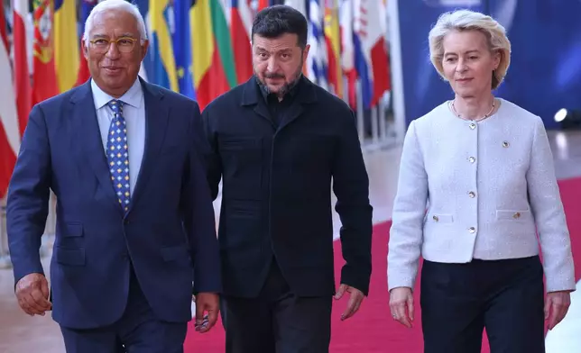 From left, European Council President Antonio Costa, Ukraine's President Volodymyr Zelenskyy and European Commission President Ursula von der Leyen arrive for the EU summit in Brussels, Thursday, June 18, 2026. (AP Photo/Omar Havana)