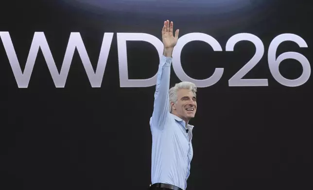 Craig Federighi, Apple's senior vice president of software engineering, waves during the annual World Wide Developers Conference at Apple's headquarters in Cupertino, Calif., Monday, June 8, 2026. (AP Photo/Noah Berger)