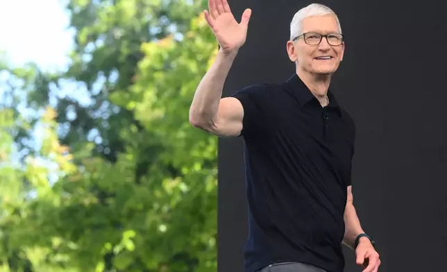 CEO Tim Cook waves during the annual World Wide Developers Conference at Apple's headquarters in Cupertino, Calif., Monday, June 8, 2026. (AP Photo/Noah Berger)