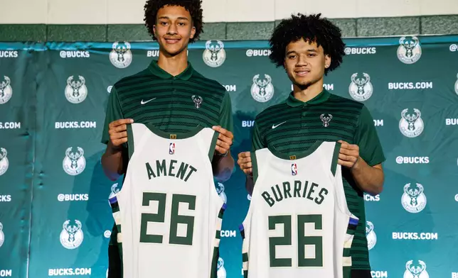 First round NBA draft picks of the Milwaukee Bucks, Nate Ament, left and Brayden Burries pose for photographs at a Boys and Girls club in Milwaukee, Thursday, June 25, 2026. (AP Photo/Jeffrey Phelps)