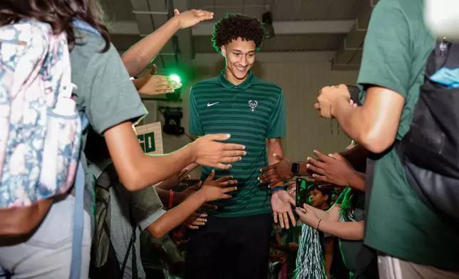 First round NBA draft pick of the Milwaukee Bucks, Nate Ament is introduced at a Boys and Girls club in Milwaukee, Thursday, June 25, 2026. (AP Photo/Jeffrey Phelps)