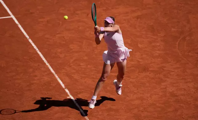 Russia's Mirra Andreeva returns to Poland's Maja Chwalinska during their final women's tennis match at the French Open in Paris, Saturday, June 6, 2026. (AP Photo/Christophe Ena)