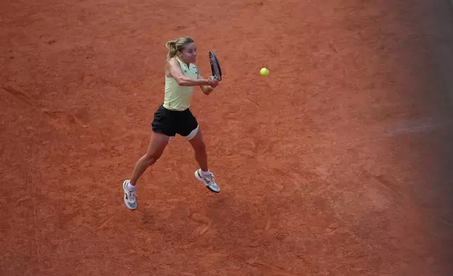 Poland's Maja Chwalinska returns to Russia's Mirra Andreeva during their final women's tennis match at the French Open in Paris, Saturday, June 6, 2026. (AP Photo/Aurelien Morissard)