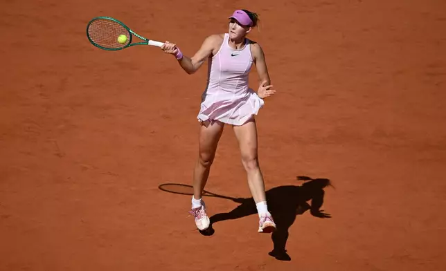Russia's Mirra Andreeva returns during the final tennis match against Poland's Maja Chwalinska at the French Open in Paris, Saturday, June 6, 2026. (AP Photo/Emma Da Silva)