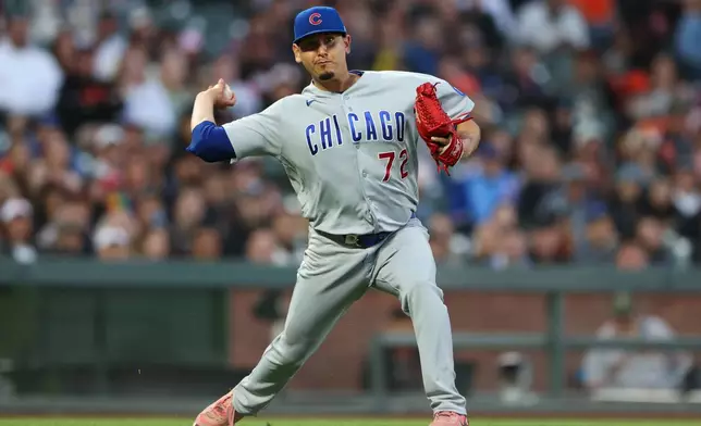 Chicago Cubs pitcher Javier Assad throws to first base for an out during the fourth inning of a baseball game against the San Francisco Giants, Friday, June 12, 2026, in San Francisco, Calif. (AP Photo/Scott Marshall)
