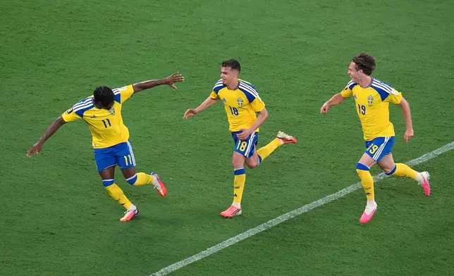 Sweden's Yasin Ayari (18) celebrates with Anthony Elanga (11) and Mattias Svanberg (19) after scoring their fifth goal during the World Cup Group F soccer match between Sweden and Tunisia in Guadalupe, near Monterrey, Mexico, Sunday, June 14, 2026. (AP Photo/Dolores Ochoa)