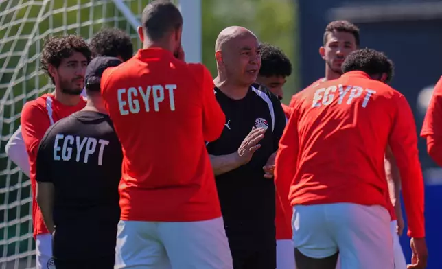 Egypt head coach Hossam Hassan talks with his players during a training session ahead of their team's World Cup Group G soccer match against Belgium in Seattle, Sunday, June 14, 2026. (AP Photo/Manu Fernandez)