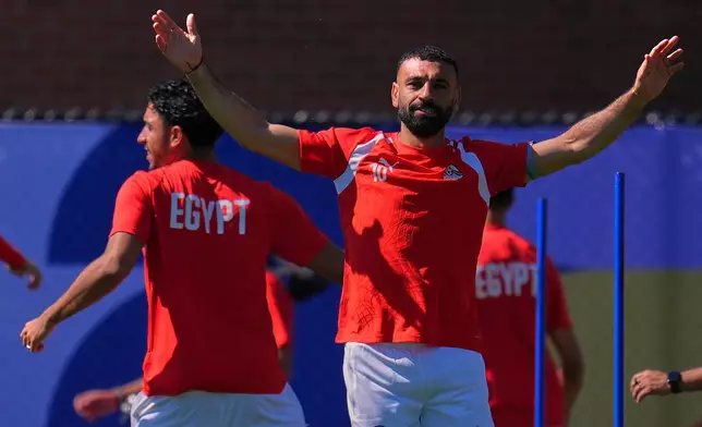 Egypt's Mohamed Salah participates with his teammates in a training session ahead of their team's World Cup Group G soccer match against Belgium in Seattle, Sunday, June 14, 2026. (AP Photo/Manu Fernandez)