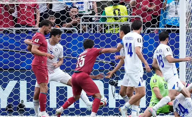 Uzbekistan's Abduvohid Nematov (12) scores an own goal during the World Cup Group K soccer match between Portugal and Uzbekistan in Houston, Tuesday, June 23, 2026. (AP Photo/Ashley Landis) CORRECTION - Corrects player who scored an own goal to Abduvohid Nematov (12)