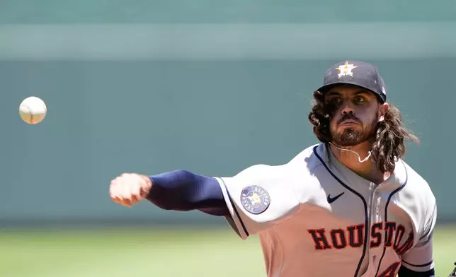 Houston Astros starting pitcher Spencer Arrighetti throws during the third inning of a baseball game against the Kansas City Royals, Sunday, June 14, 2026, in Kansas City, Mo. (AP Photo/Charlie Riedel)