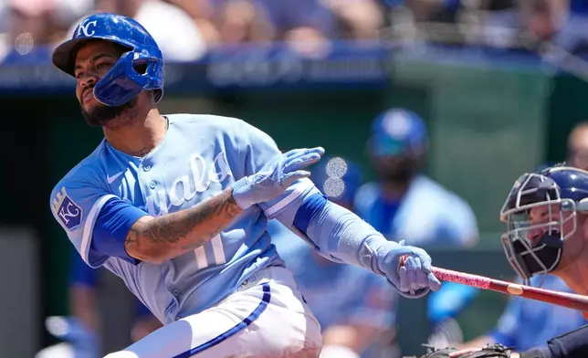 Kansas City Royals' Maikel Garcia watches his two-run double during the third inning of a baseball game against the Houston Astros, Sunday, June 14, 2026, in Kansas City, Mo. (AP Photo/Charlie Riedel)