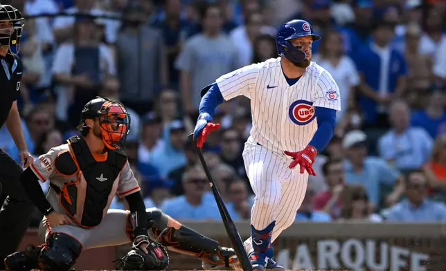Chicago Cubs' Michael Busch watches his game-winning RBI single to defeat the San Francisco Giants in the 10th inning of a baseball game in Chicago, Saturday, June 6, 2026. (AP Photo/Paul Beaty)
