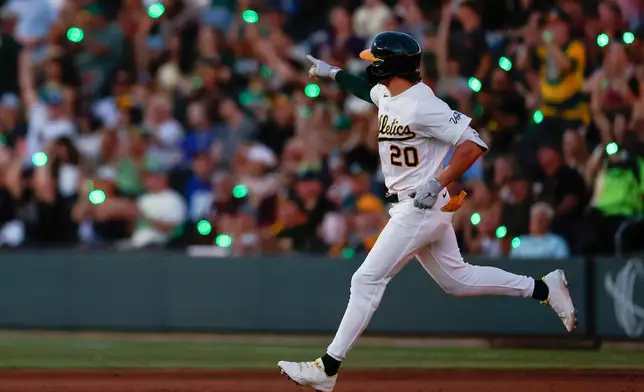 Athletics' Zack Gelof rounds the bases after hitting a two-run home run during the fourth inning of a baseball game against the Colorado Rockies, Saturday, June 13, 2026, in Las Vegas. (AP Photo/Caroline Brehman)
