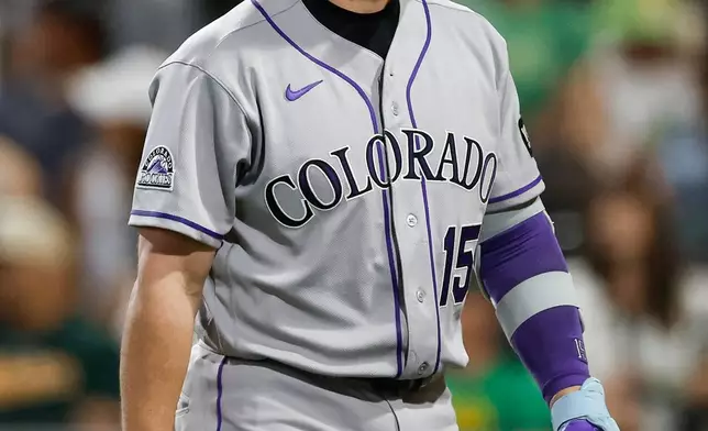 Colorado Rockies designated hitter Hunter Goodman (15) reacts after striking out during the eighth inning of a baseball game against the Athletics, Saturday, June 13, 2026, in Las Vegas. (AP Photo/Caroline Brehman)