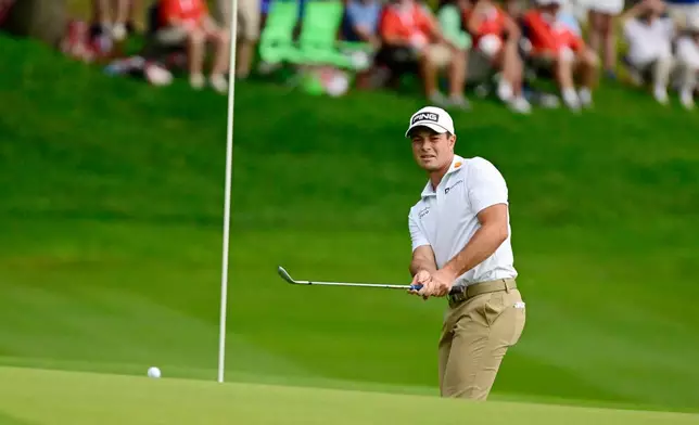 Viktor Hovland, of Norway, watches his shot land near the pin on the 15th green during the third round of the Travelers Championship golf tournament at TPC River Highlands, Saturday, June 27, 2026, in Cromwell, Conn. (AP Photo/Jessica Hill)