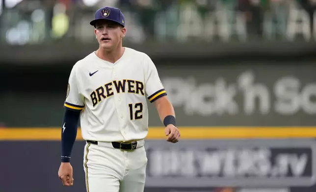 Milwaukee Brewers' Cooper Pratt warms up before a baseball game against the Cleveland Guardians, Tuesday, June 16, 2026, in Milwaukee. (AP Photo/Aaron Gash)