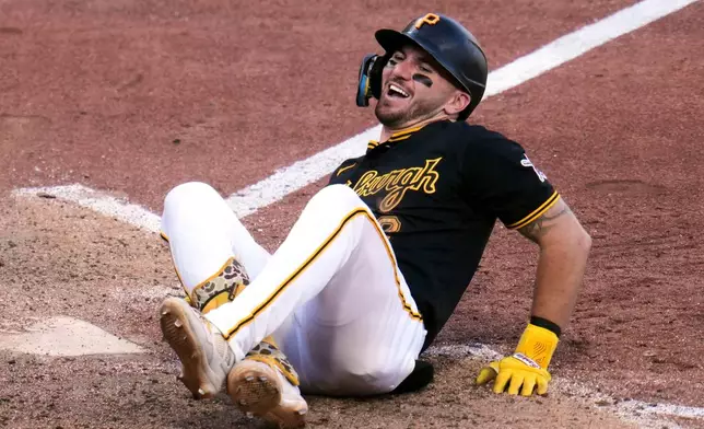 Pittsburgh Pirates' Spencer Horwitz reacts after being hit by a pitch from Miami Marlins' Anthony Bender with bases loaded during the eighth inning of a baseball game in Pittsburgh, Saturday, June 13, 2026. (AP Photo/Gene J. Puskar)