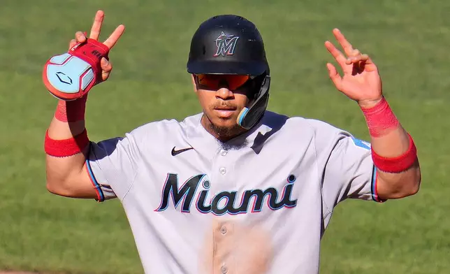 Miami Marlins' Heriberto Hernández celebrates after driving in a run with a single off Pittsburgh Pirates pitcher Mason Montgomery during the sixth inning of a baseball game in Pittsburgh, Saturday, June 13, 2026. (AP Photo/Gene J. Puskar)
