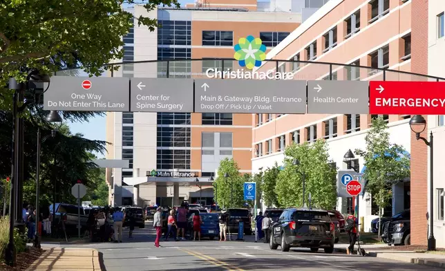 The main entrance to Wilmington Hospital is shown in the aftermath of a shooting on Tuesday, June 16, 2026, in Wilmington, Del. (AP Photo/Mingson Lau)