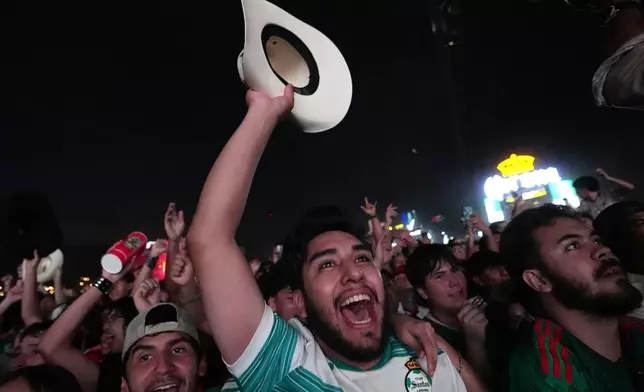 FILE - Fans celebrate after Mexico's Luis Romo scored during a World Cup soccer match between Mexico and South Korea at the FIFA Fan Zone in Monterrey, Mexico, June 18, 2026. (AP Photo/Dolores Ochoa, File)