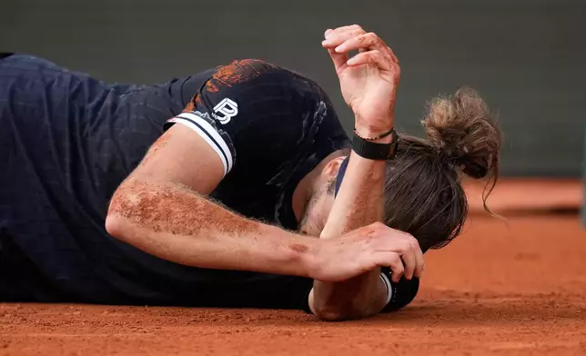 Alexander Zverev of Germany reacts after winning the men's final match against Flavio Cobolli of Italy at the French Open tennis tournament in Paris, Sunday, June 7, 2026. (AP Photo/Christophe Ena)