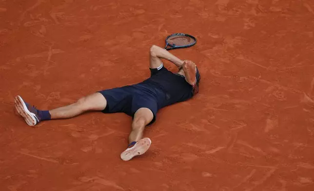 Alexander Zverev of Germany reacts after winning the men's final match against Flavio Cobolli of Italy at the French Open tennis tournament in Paris, Sunday, June 7, 2026. (AP Photo/Aurelien Morissard)