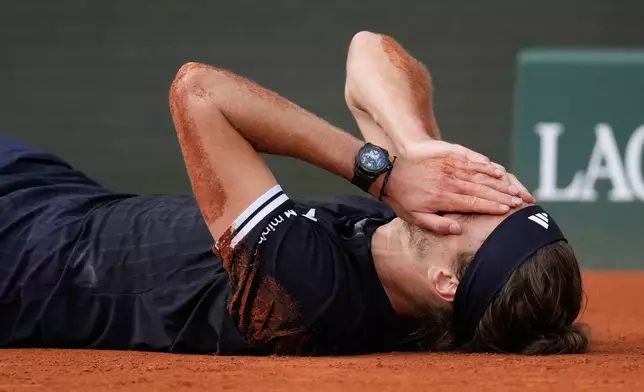 Alexander Zverev of Germany celebrates after winning the men's final match against Flavio Cobolli of Italy at the French Open tennis tournament in Paris, Sunday, June 7, 2026. (AP Photo/Christophe Ena)