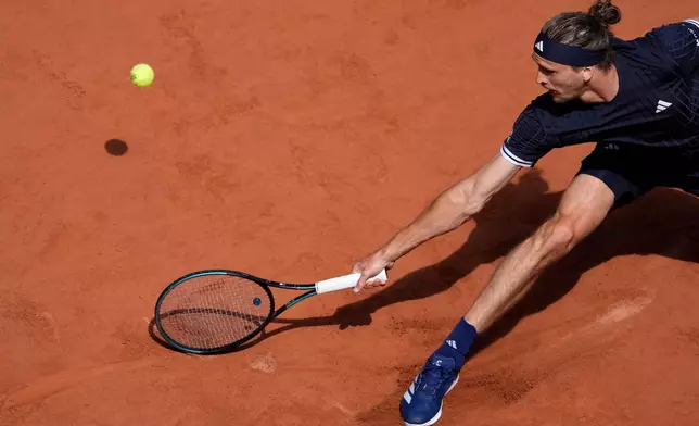 Alexander Zverev of Germany returns to Flavio Cobolli of Italy during their men's final match at the French Open tennis tournament in Paris, Sunday, June 7, 2026. (AP Photo/Christophe Ena)