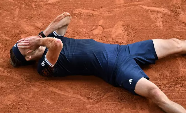 Germany's Alexander Zverev reacts after winning the final tennis match against Italy's Flavio Cobolli at the French Open in Paris, Sunday, June 7, 2026. (AP Photo/Emma Da Silva)