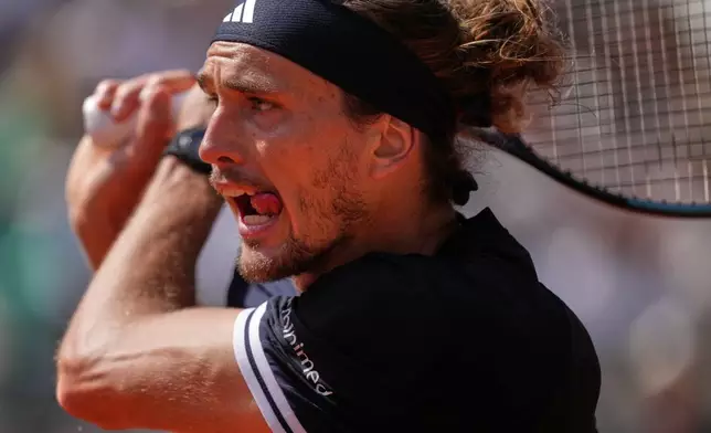 Germany's Alexander Zverev returns during the final tennis match against Italy's Flavio Cobolli at the French Open in Paris, Sunday, June 7, 2026. (AP Photo/Thibault Camus)