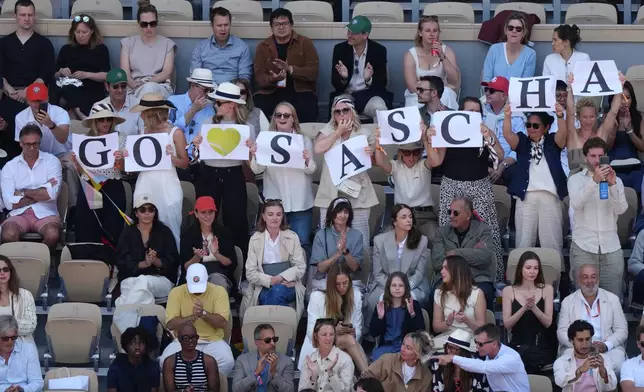 Fans of Alexander Zverev of Germany support him before the men's final match against Flavio Cobolli of Italy at the French Open tennis tournament in Paris, Sunday, June 7, 2026. (AP Photo/Aurelien Morissard)