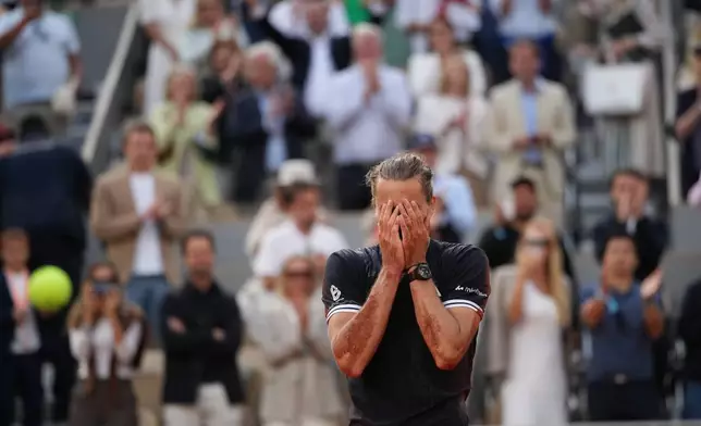 Alexander Zverev of Germany celebrates after winning the men's final match against Flavio Cobolli of Italy at the French Open tennis tournament in Paris, Sunday, June 7, 2026. (AP Photo/Christophe Ena)