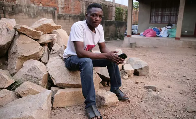 Bienfait Wanzire, an Ebola survivor, sits by his house in Beni, Congo, Monday, June 1, 2026. (AP Photo/Kitsa Musayi Sebastien)