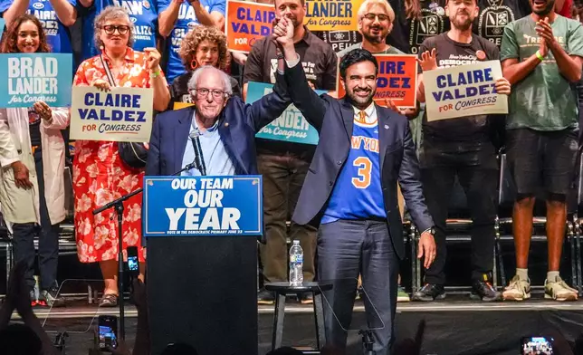 Mayor Zohran Mamdani, right, gestures on stage with U.S. Sen. Bernie Sanders, I-VT., during a Get Out The Vote rally ahead of New York's primary election, Thursday, June 18, 2026, in the Brooklyn borough of New York. (AP Photo/Ryan Murphy)