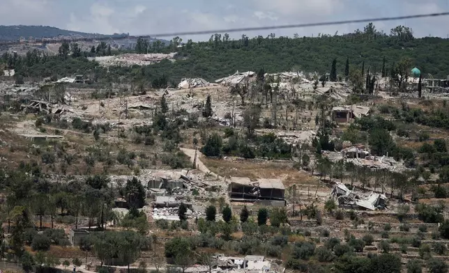 Homes lie in ruins in previous Israeli airstrikes in the southern village of Haneen, Lebanon, Thursday, June 18, 2026. (AP Photo/Bilal Hussein)
