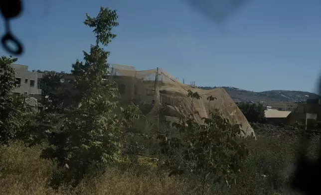An Israeli tank takes position in the southern Christian village of Debel, Lebanon, Thursday, June 18, 2026. (AP Photo/Bilal Hussein)