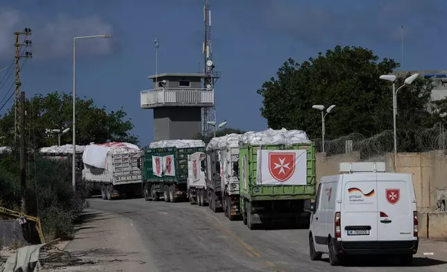 A convoy carrying emergency livestock feed and supplies for farmers from an aid convoy organized by the Order of Malta, a Catholic lay religious order, in the southern Christian village of Ain Ebel, Lebanon, Thursday, June 18, 2026. (AP Photo/Bilal Hussein)