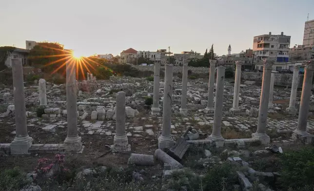 Parts of a power generator damaged in an Israeli airstrike lie among Roman-era columns at an archaeological site, which was lightly damaged in an Israeli strike nearby last week, in the southern port city of Tyre, Lebanon, Thursday, June 18, 2026. (AP Photo/Hassan Ammar)