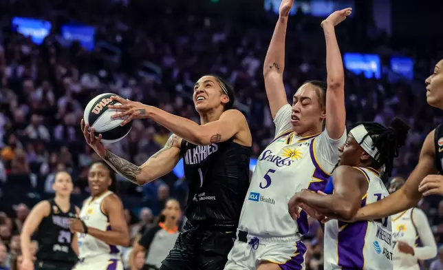 Golden State Valkyries' Gabby Williams (1) drives to the basket in the first half of a WNBA basketball game against the Los Angeles Sparks, Monday, June 15, 2026, in San Francisco. (Carlos Avila Gonzalez/San Francisco Chronicle via AP)