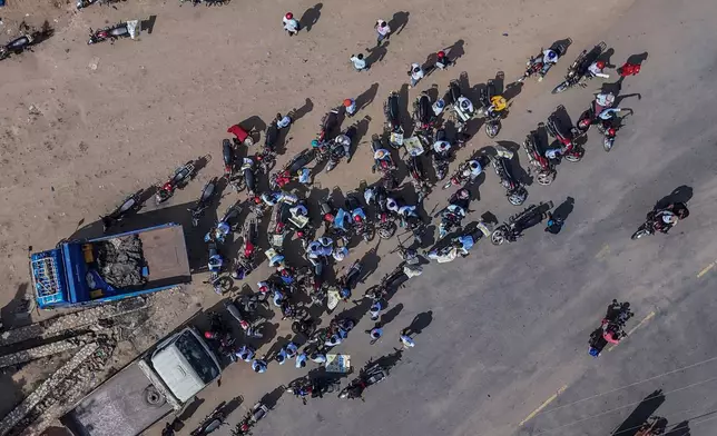 A drone view of motorcyclists as they join an awareness campaign organized by the World Health Organization (WHO) to combat Ebola in Bunia, Congo, Wednesday, June 10, 2026. (AP Photo/Moses Sawasawa)