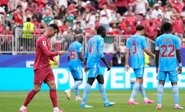 Portugal's Cristiano Ronaldo, left, reacts after failing to score during the World Cup Group K soccer match between Portugal and Congo in Houston, Wednesday, June 17, 2026. (AP Photo/Ashley Landis)