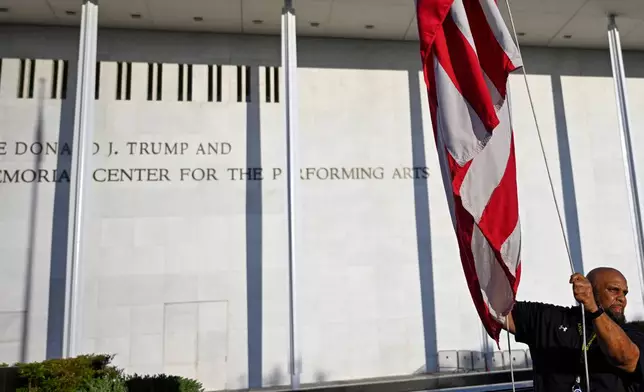 The American flag is raised in front of The John F. Kennedy Center for the Performing Arts, Friday, June 12, 2026, in Washington. (AP Photo/John McDonnell