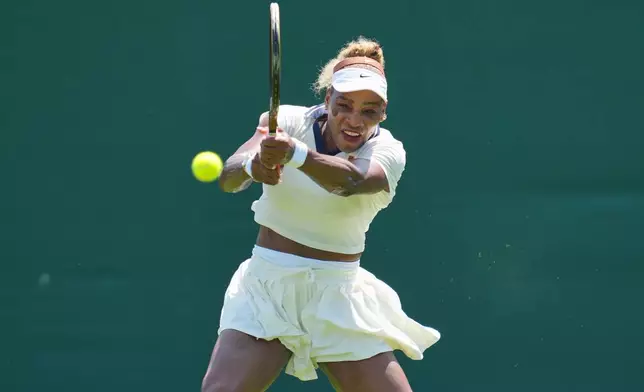 Serena Williams of the United States plays a return during a practice session ahead of the Wimbledon Tennis Championships, in London, Wednesday, June 24, 2026. (AP Photo/Kin Cheung)