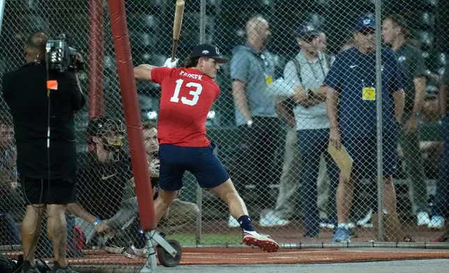 Cole Prosek, a third baseman/catcher at Magnolia Heights High School, gets ready to take a swing during batting practice at the MLB baseball combine in Phoenix, Tuesday, June 23, 2026. (AP Photo/Ross D. Franklin)