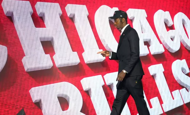 Caleb Wilson walks off the stage after being selected by the Chicago Bulls in the first round of the NBA basketball draft, Tuesday, June 23, 2026, in New York. (AP Photo/Yuki Iwamura)