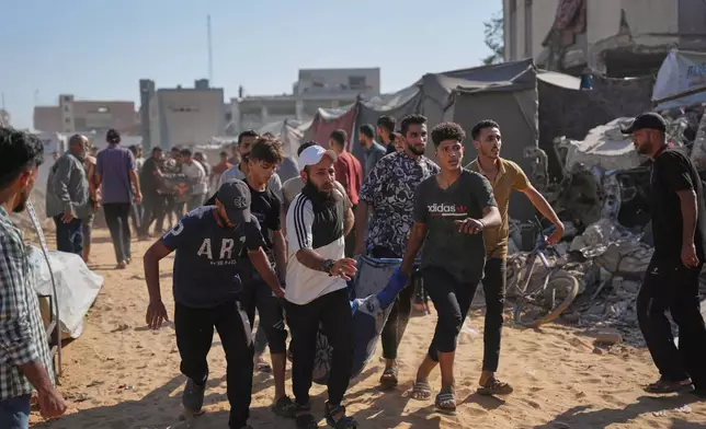 Residents evacuate a wounded man who was injured in an Israeli airstrike that targeted a tent housing Palestinians, in Gaza City, Saturday, June 6, 2026. (AP Photo/Abdel Kareem Hana)