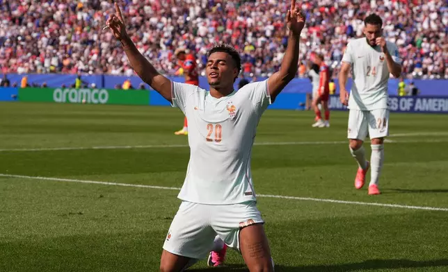 France's Desire Doue (20) celebrates after scoring his side's fourth goal during the World Cup Group I soccer match between Norway and France in Foxborough, Mass., near Boston, Friday, June 26, 2026. (AP Photo/Charles Krupa)