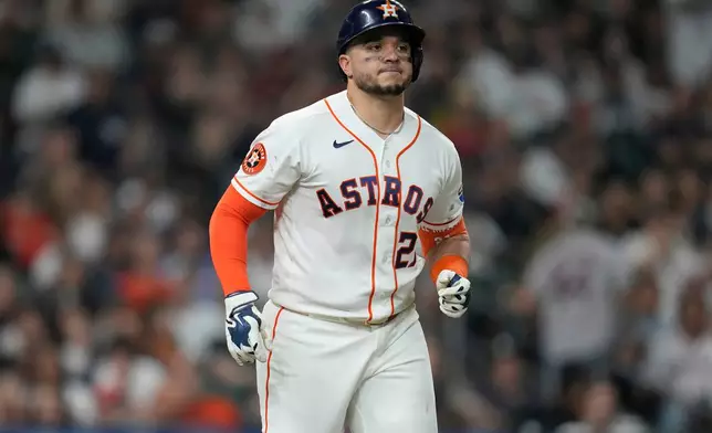 FILE - Houston Astros designated hitter Yainer Diaz (21) reacts to striking out against New York Yankees relief pitcher Fernando Cruz during the sixth inning of a baseball game, Saturday, April 25, 2026, in Houston. (AP Photo/Karen Warren,File)